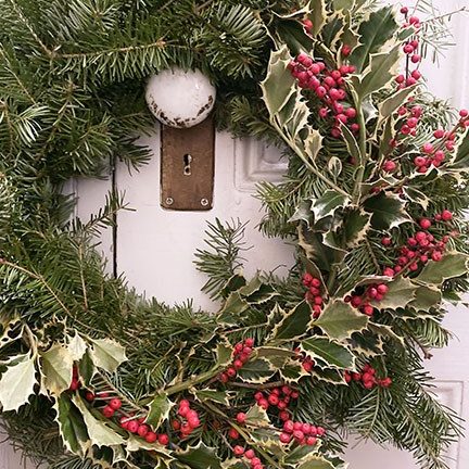 Evergreen wreath with holly berries