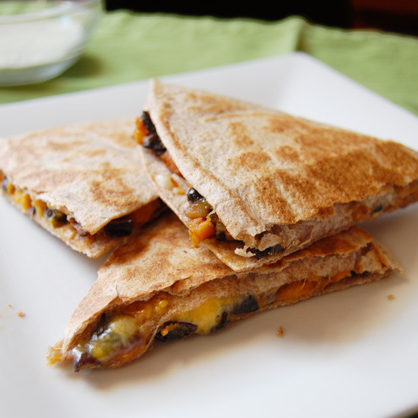 Black beans, roasted sweet potato, and just the right amount of cheese come together for these crispy, filling quesadillas